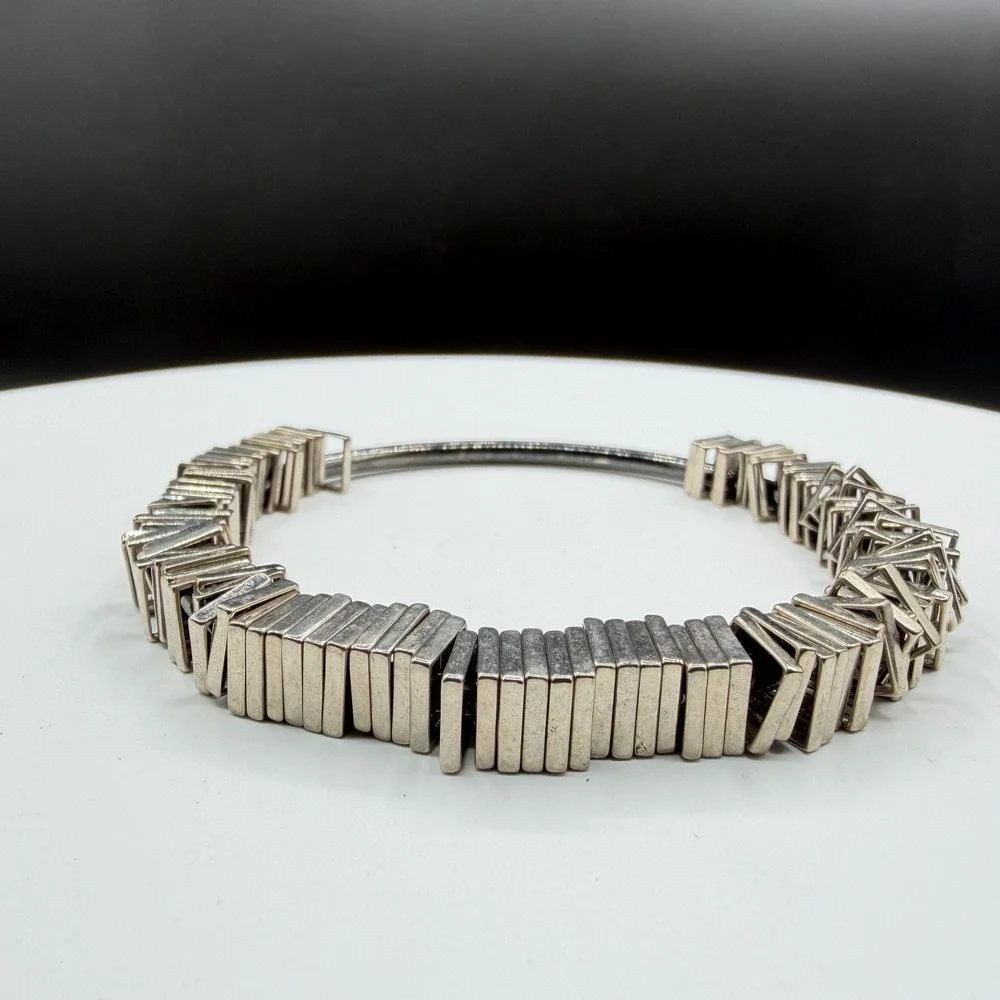 N/A sculptural silver